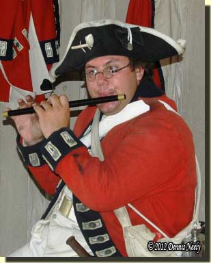 A British soldier from the King's 8th plays the fife.