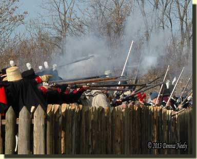 Winchester's troops fire from behind Frenchtown's north fence.