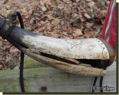 The ruptured powder horn, split in two, end for end.