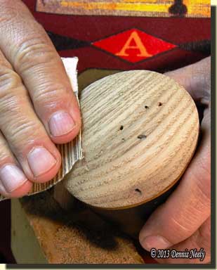 Sanding a wormy chestnut plug in a powder horn