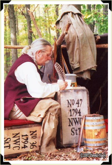 A traditional woodsman writing in his journal.
