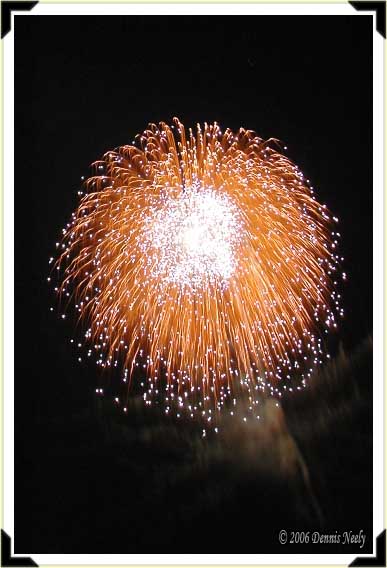 A fireworks shell exploding in all its glory.
