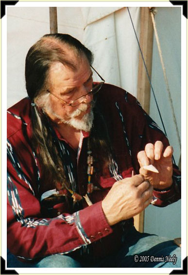 Traditional archer Norm Blaker showing a finished arrow head.