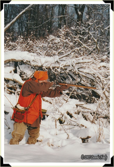 A traditional woodsman taking aim at a fleeing cottontail rabbit.