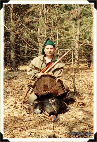 A "young" traditioinal hunter with a triple-beard tom.