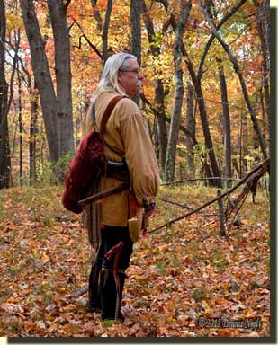 A traditional woodsman pauses before choosing the next path.
