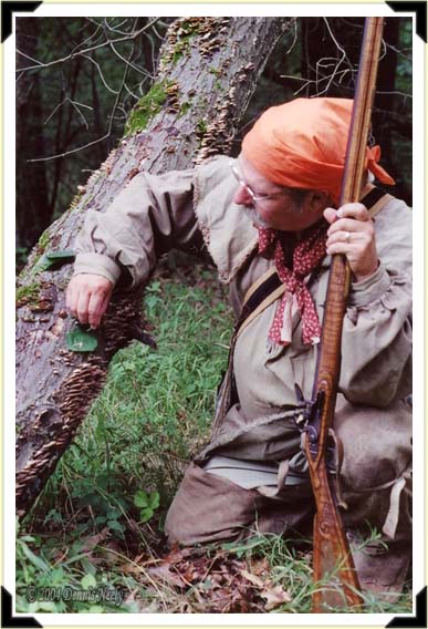 A traditional woodsman hunting fox squirrels with a Dickert rifle.