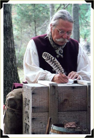 A traditional woodsman writes in his journal.