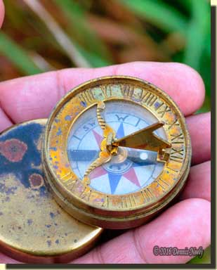 A reproduction of an 18th-century brass compass.