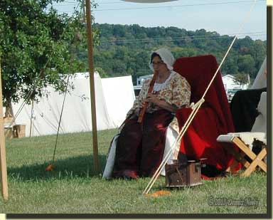 A lady of the forest playing her Native American love flute at Friendship, Indiana.